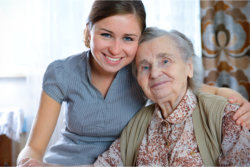 smiling caregiver and elderly woman